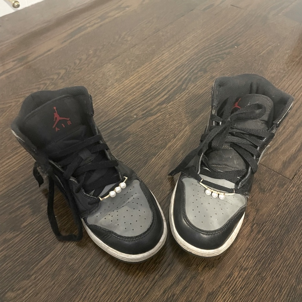 Black and grey Jordan mids